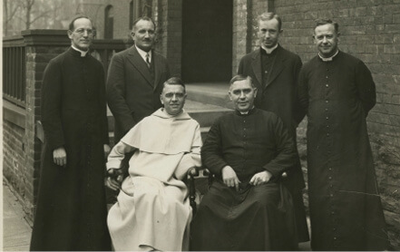 PIMS faculty in front of No. 10 Elmsley Place. Seated: M.D. Chenu, E.J. McCorkell. Standing: G.B. Phelan, Étienne Gilson, B.F. Sullivan, H.S. Bellisle.