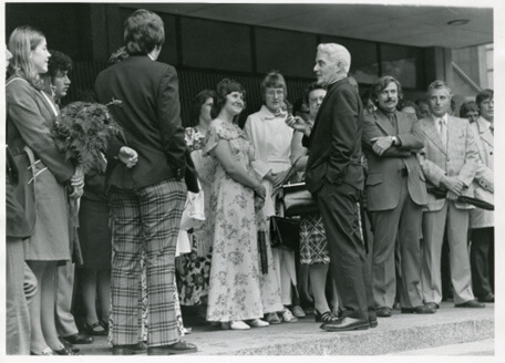 Fr. Kelly and guests at the William McElcheran statue unveiling in front of the Kelly Library in 1973.